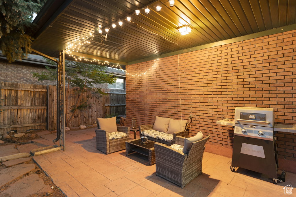 View of patio featuring a grill and an outdoor hangout area