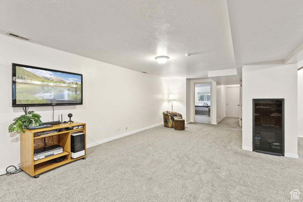 Living room with beverage cooler and carpet floors
