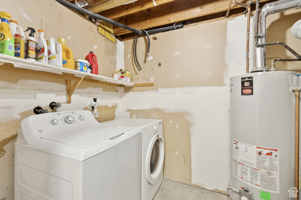 Laundry area with gas water heater and independent washer and dryer