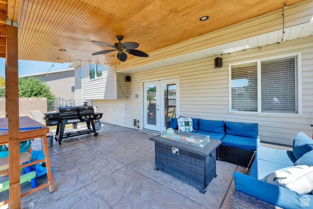 View of patio with an outdoor hangout area, french doors, outdoor dining space, and a ceiling fan