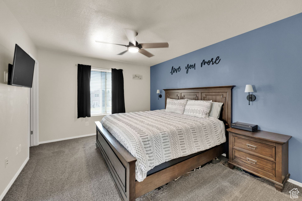 Bedroom featuring carpet floors and ceiling fan