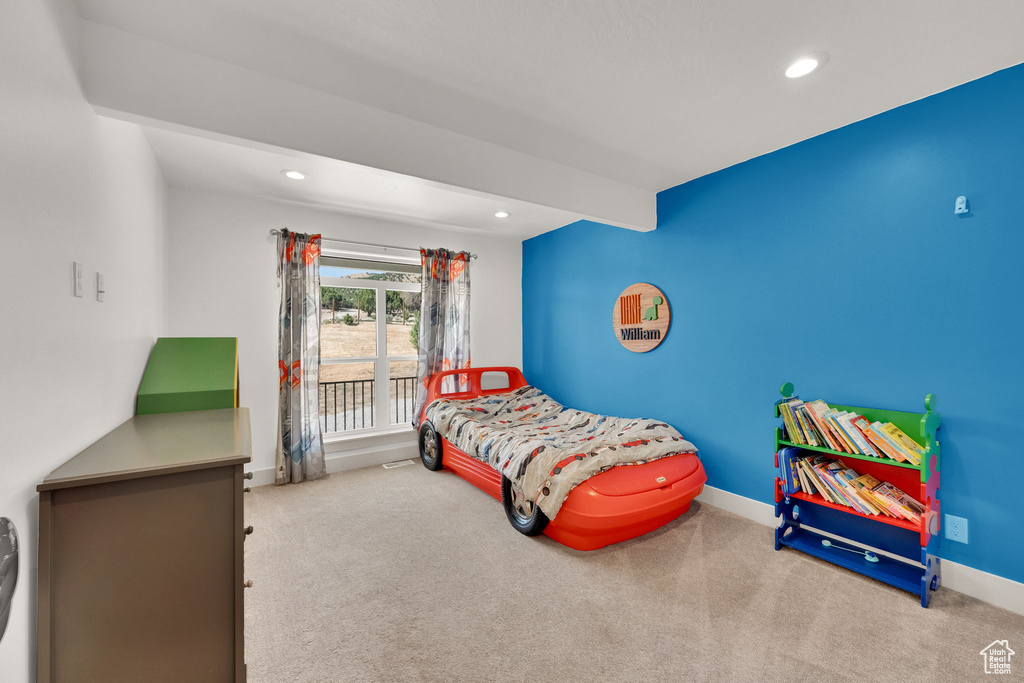 Carpeted bedroom featuring recessed lighting and baseboards