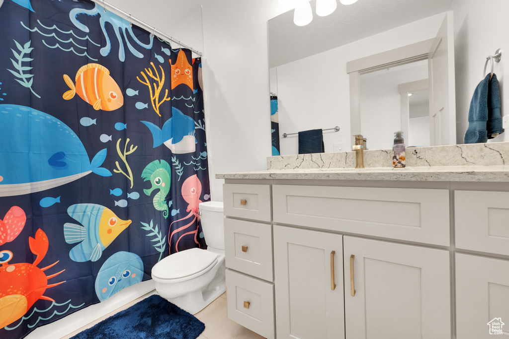 Full bath featuring vanity and a shower with curtain