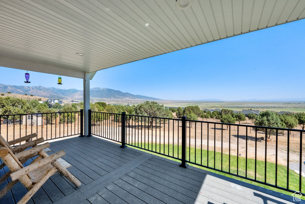 Wooden deck featuring a mountain view