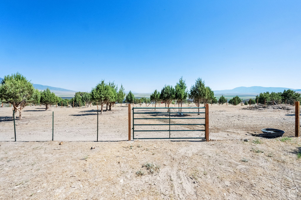 View of yard with a mountain view and a view of countryside