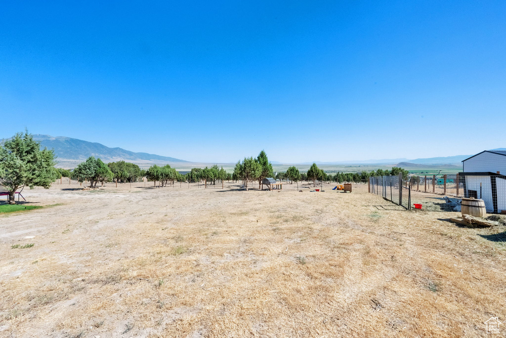 View of yard featuring a view of countryside and a mountain view