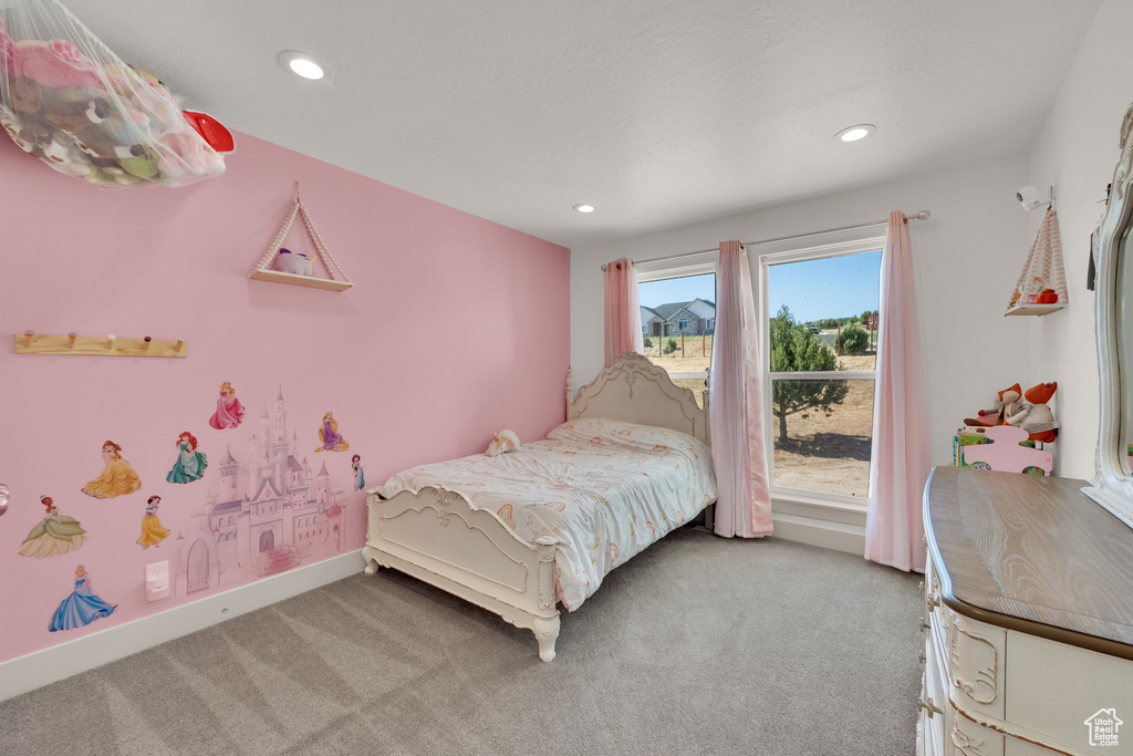 Bedroom with light carpet and recessed lighting