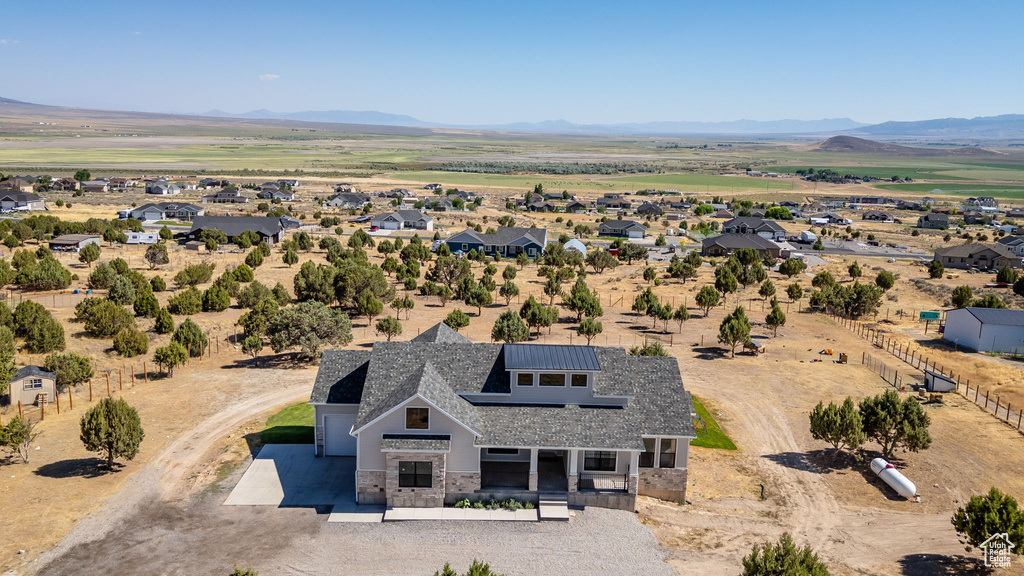 View from above of property featuring a mountainous background
