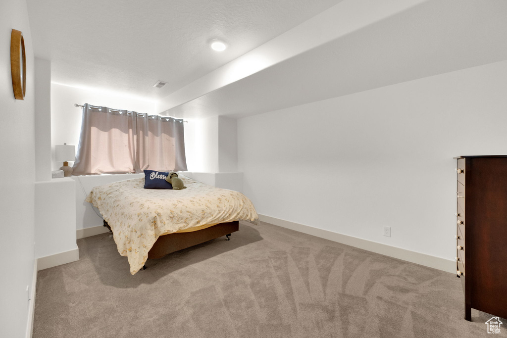 Bedroom featuring carpet flooring