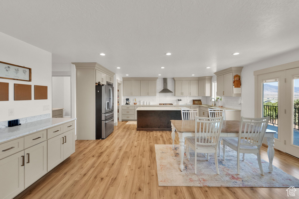 Dining space featuring light wood-style flooring and recessed lighting