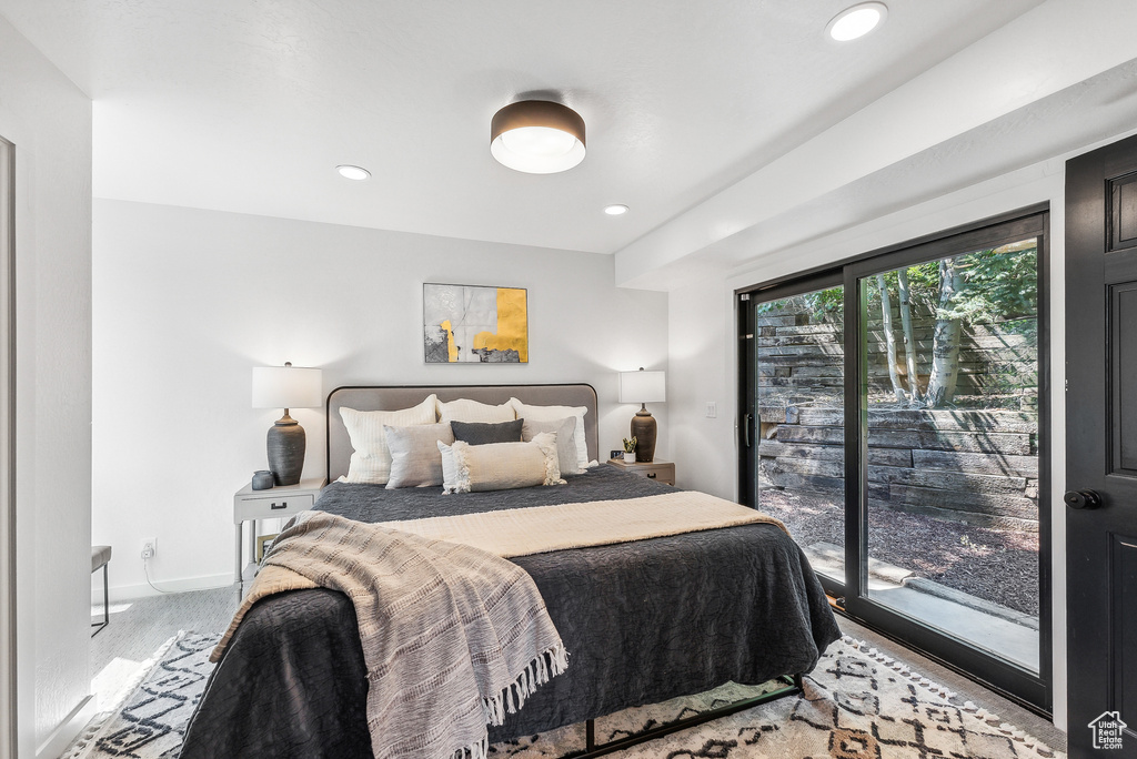 Carpeted bedroom with access to exterior and recessed lighting
