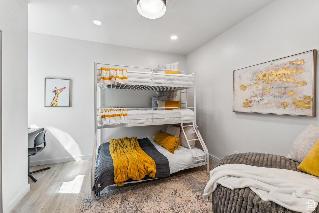 Bedroom featuring wood finished floors and recessed lighting