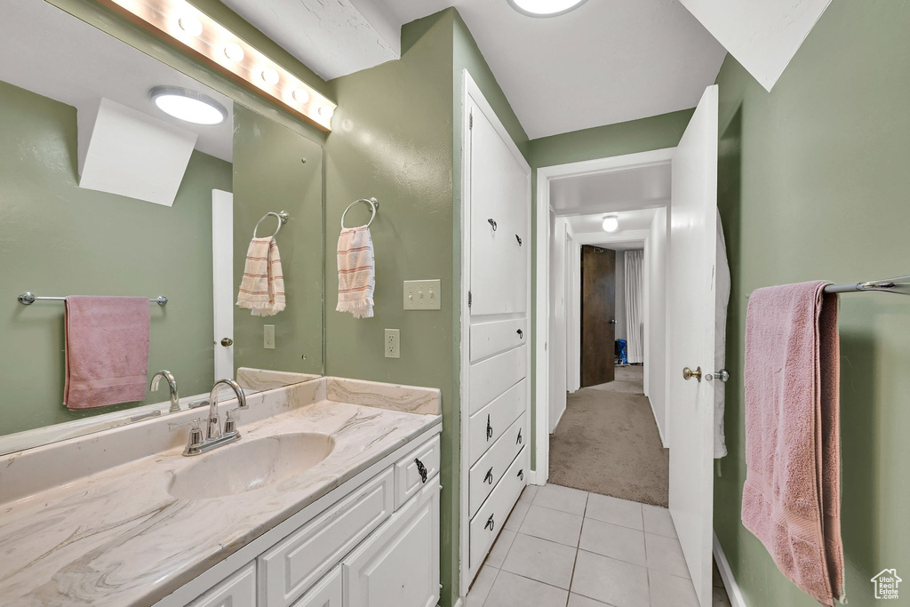 Bathroom featuring vanity and tile patterned flooring
