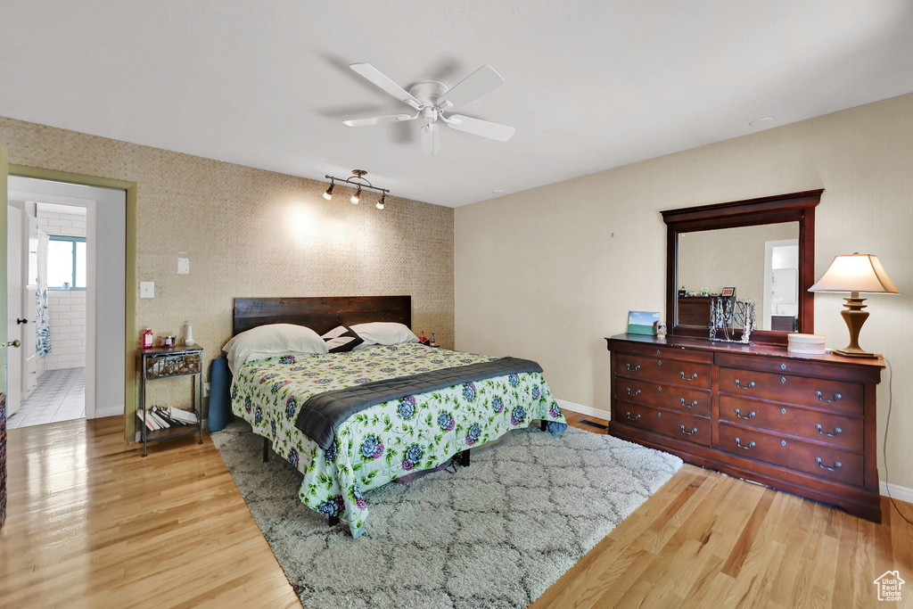Bedroom featuring wood finished floors and a ceiling fan