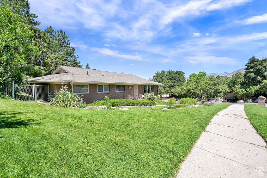 View of front of house with brick siding