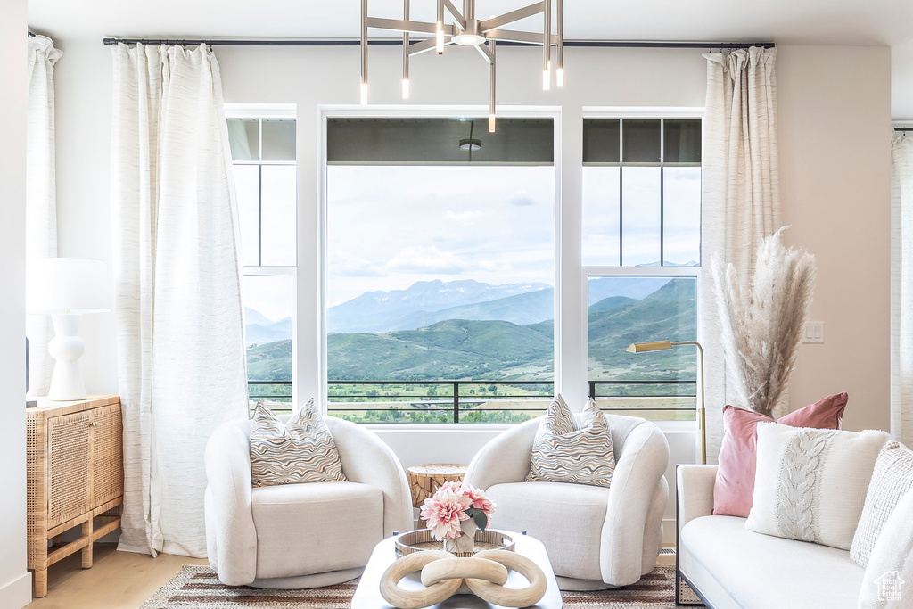 Living room with a chandelier and a mountain view
