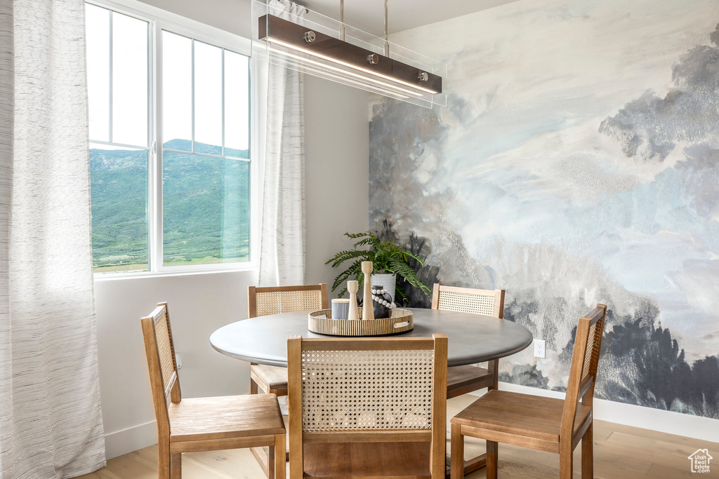 Dining room with baseboards and wood finished floors