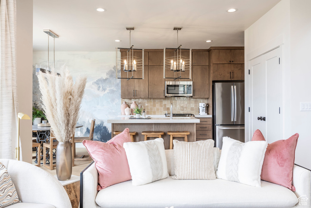 Living room with recessed lighting and a chandelier