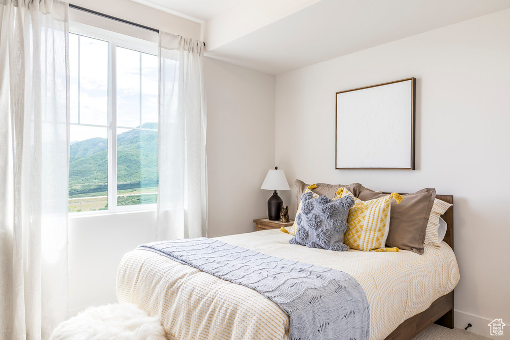 Bedroom with multiple windows