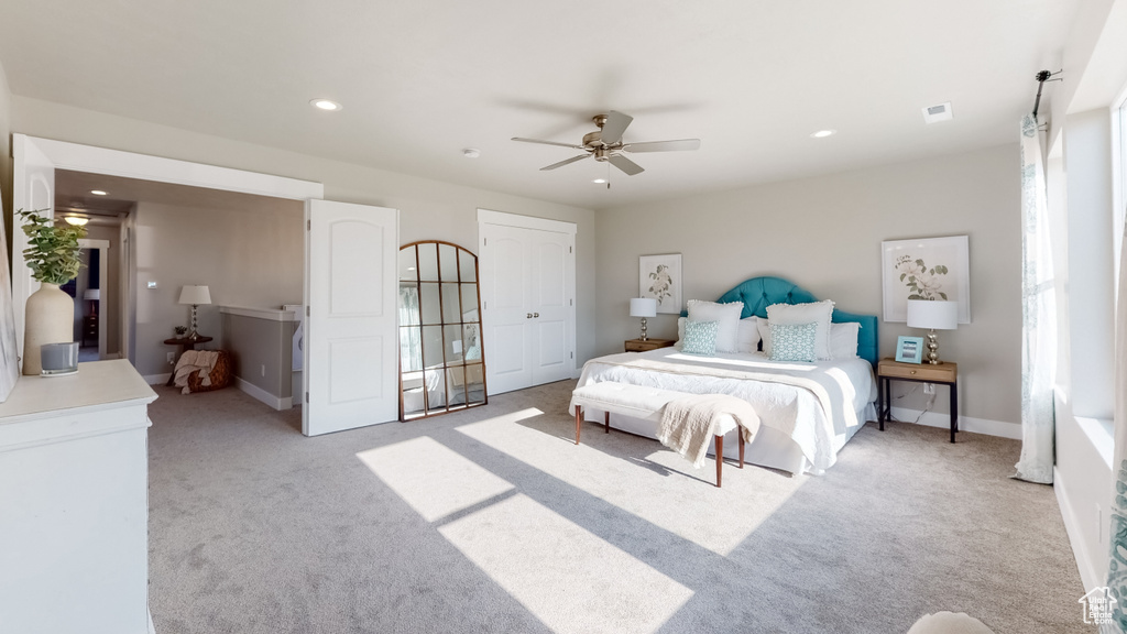 Bedroom featuring light carpet, recessed lighting, and a ceiling fan