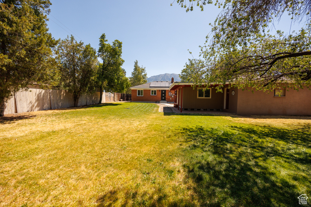 View of yard with a patio area and a mountain view