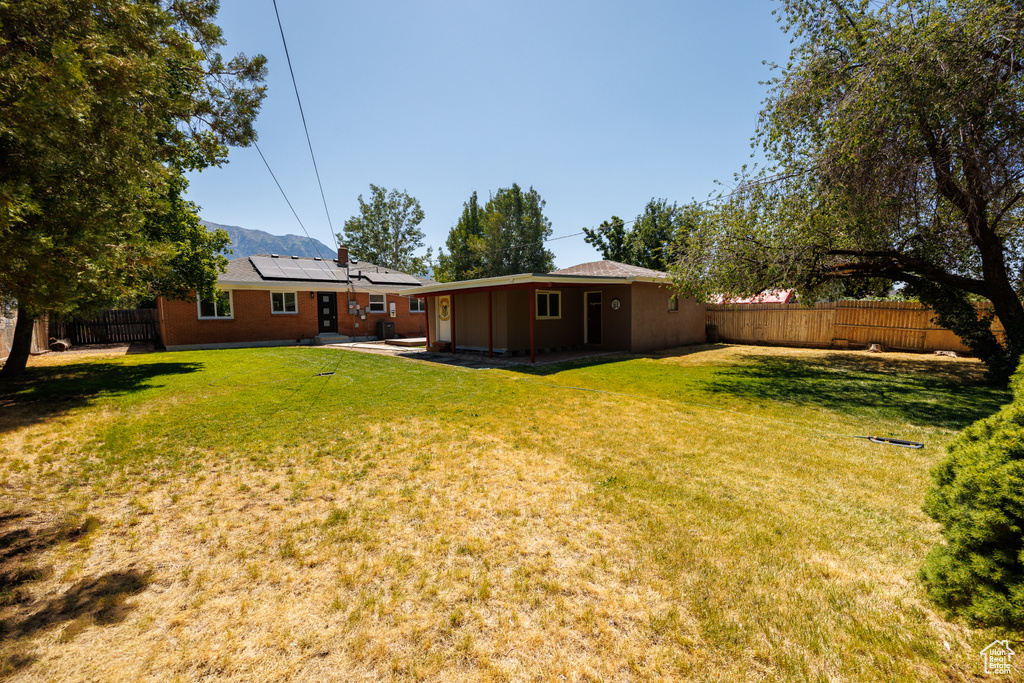 Fenced backyard featuring a patio area