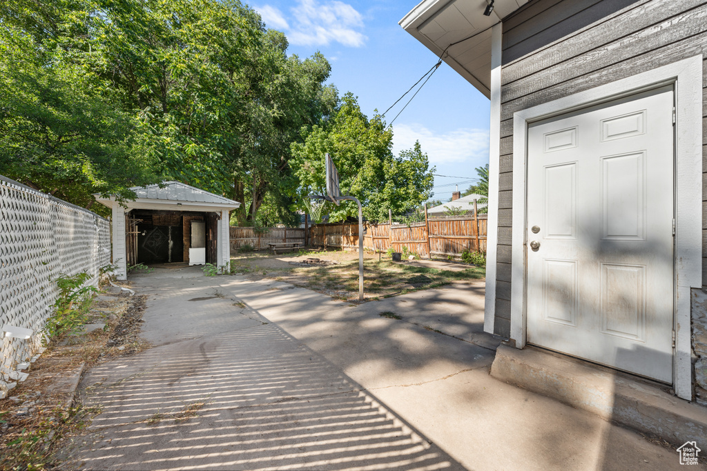 Fenced backyard with a storage unit