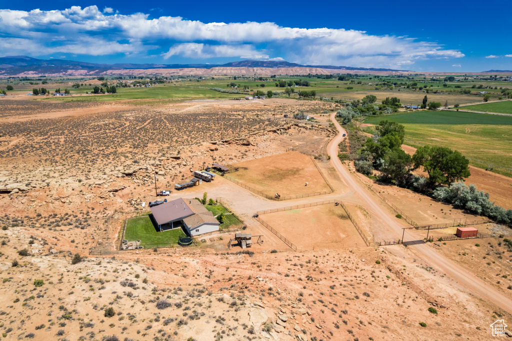Overview of rural landscape featuring a mountain backdrop