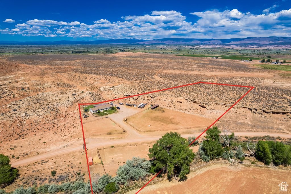 View of rural area with property boundaries highlighted and a mountainous background