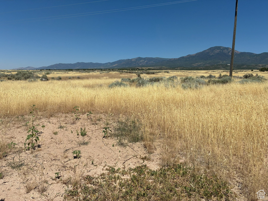 View of mountain backdrop featuring rural landscape