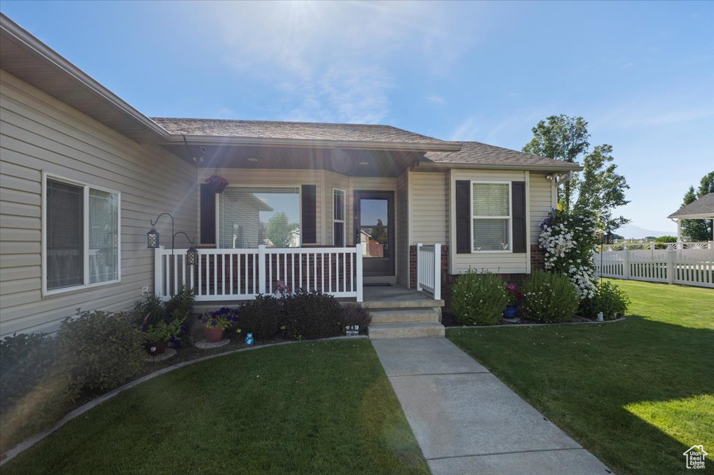 View of exterior entry featuring a porch