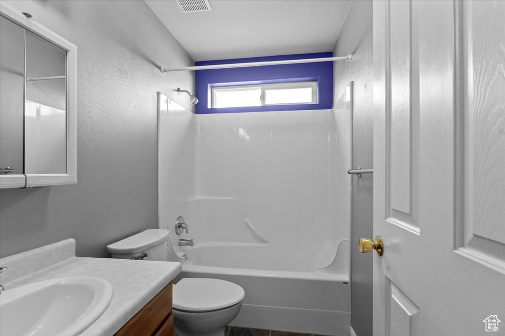 Bathroom with vanity and shower / bathtub combination