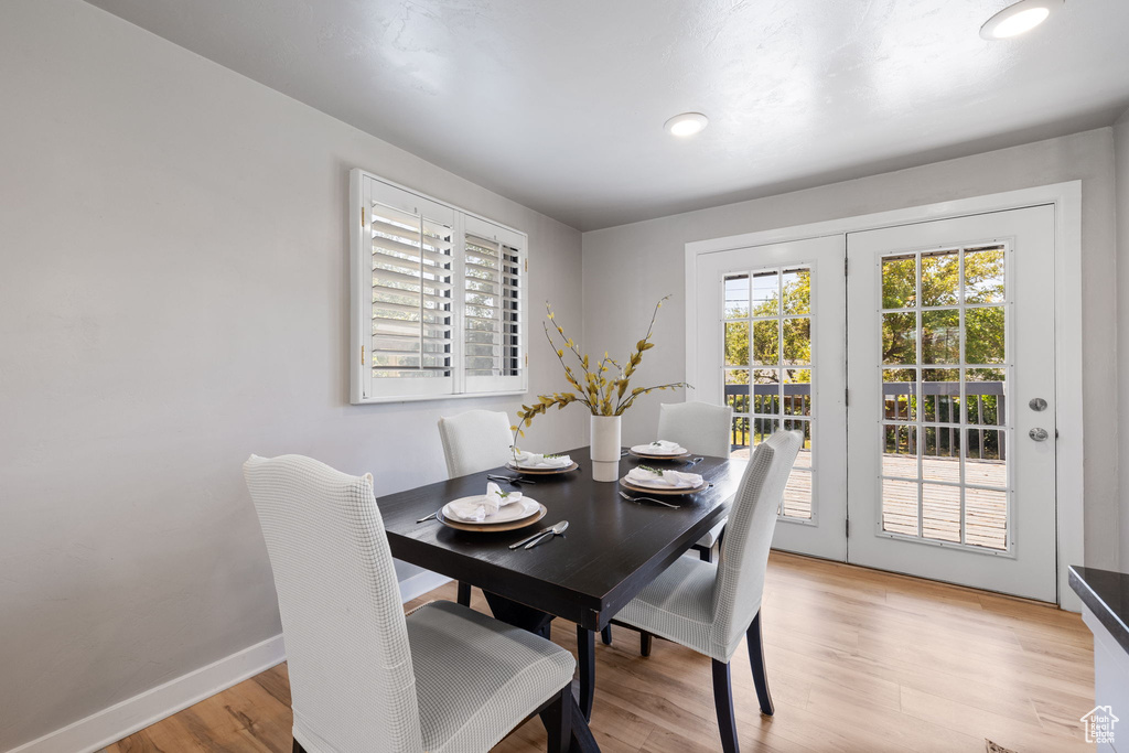 Dining room featuring light wood-style floors and baseboards