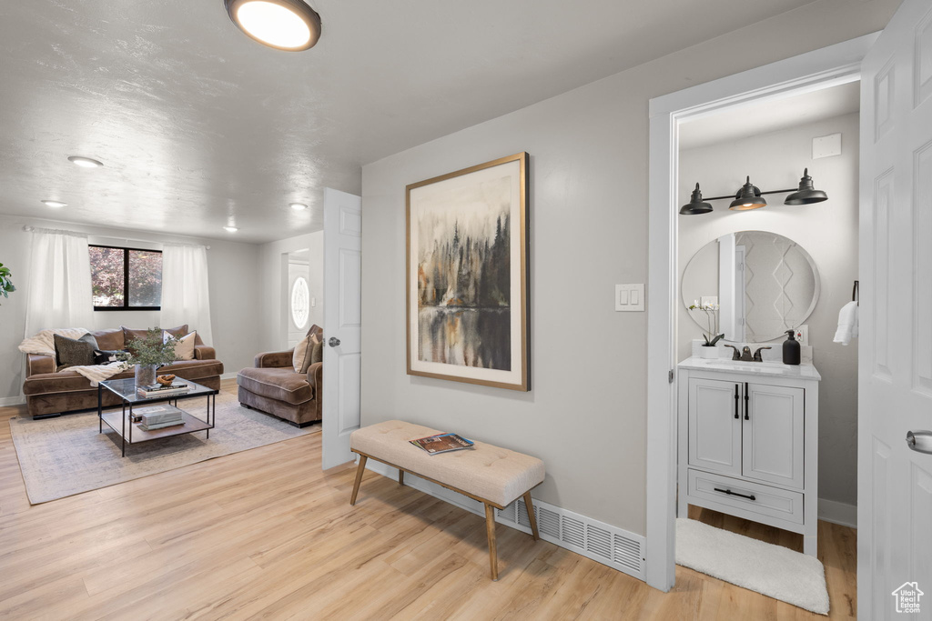Living room with light wood finished floors and baseboards