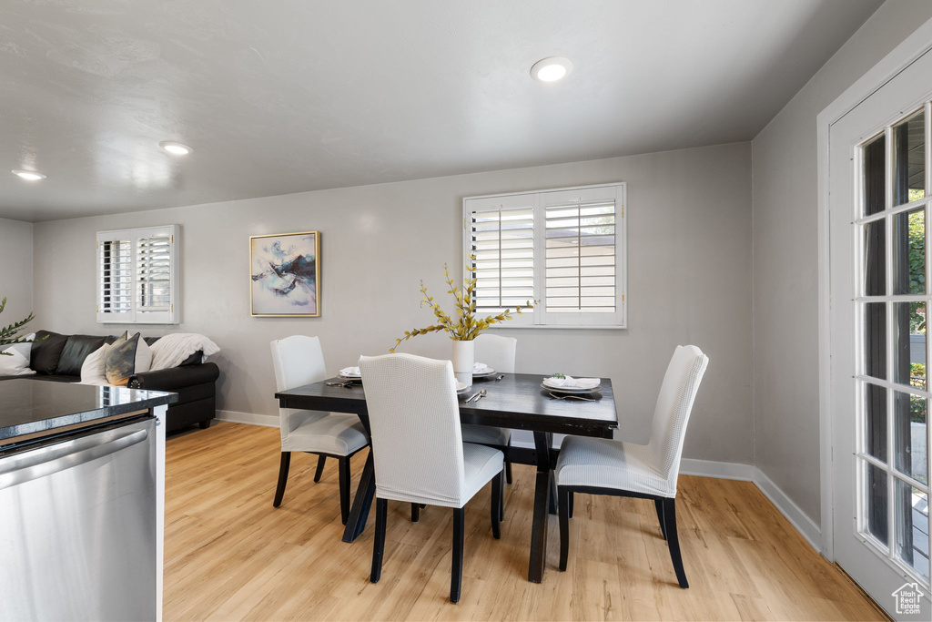 Dining room featuring light wood-style floors and recessed lighting