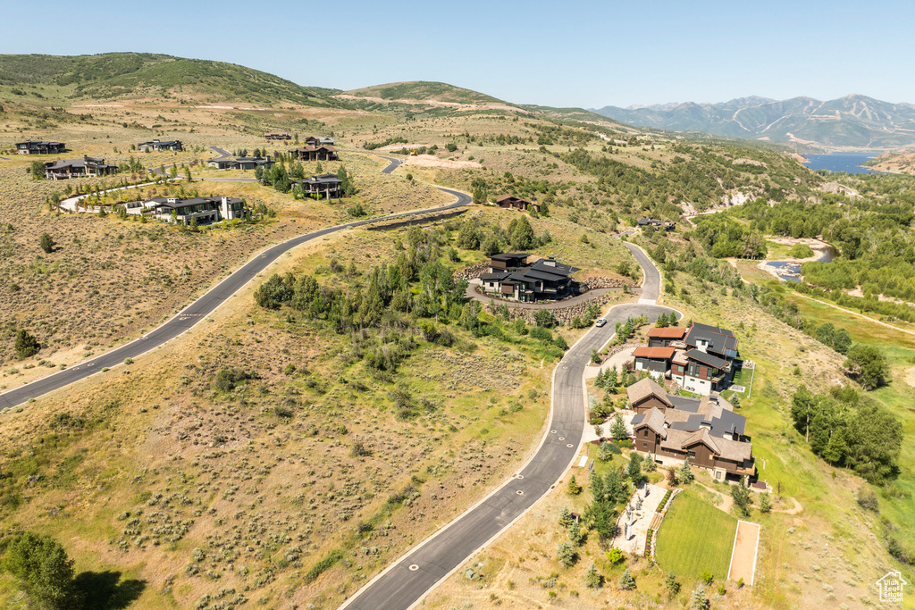 Aerial view of property's location featuring a mountain backdrop