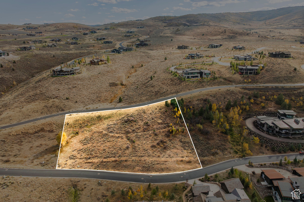 Aerial view of property's location with property parcel outlined and rural landscape