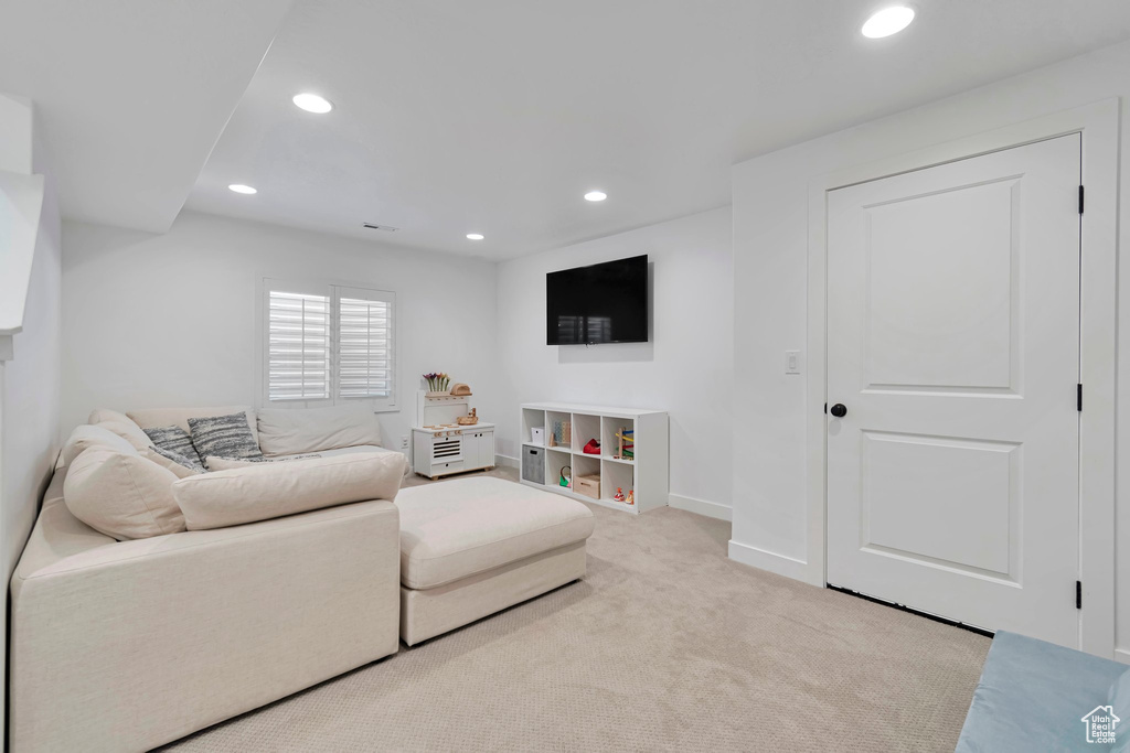 Living area featuring recessed lighting and carpet floors