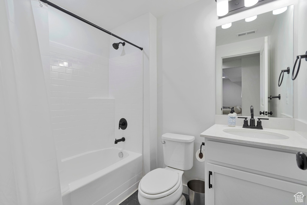 Full bath with shower / bath combination with curtain and vanity