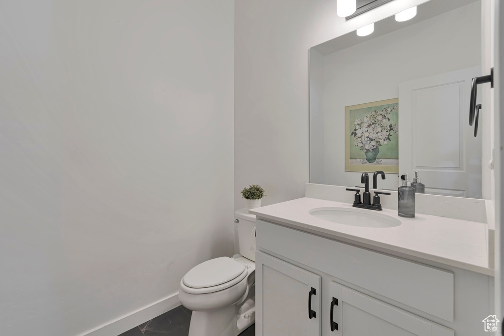 Bathroom with toilet and vanity