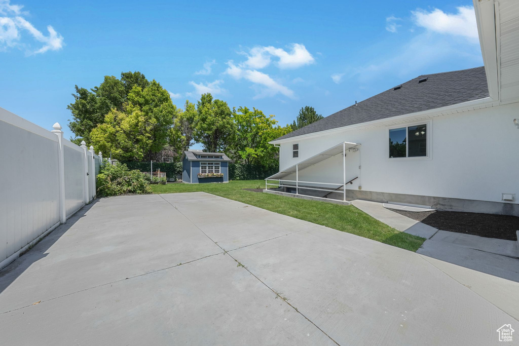 View of patio / terrace featuring a storage shed
