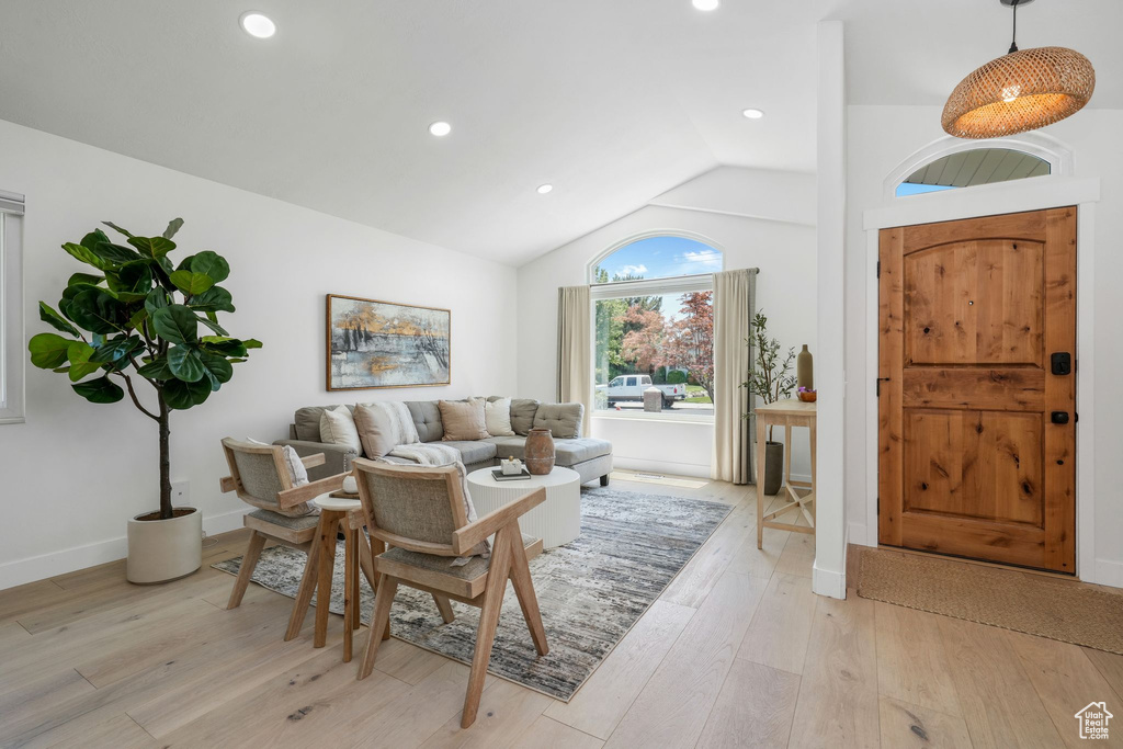 Entrance foyer with light wood-type flooring, vaulted ceiling, and recessed lighting