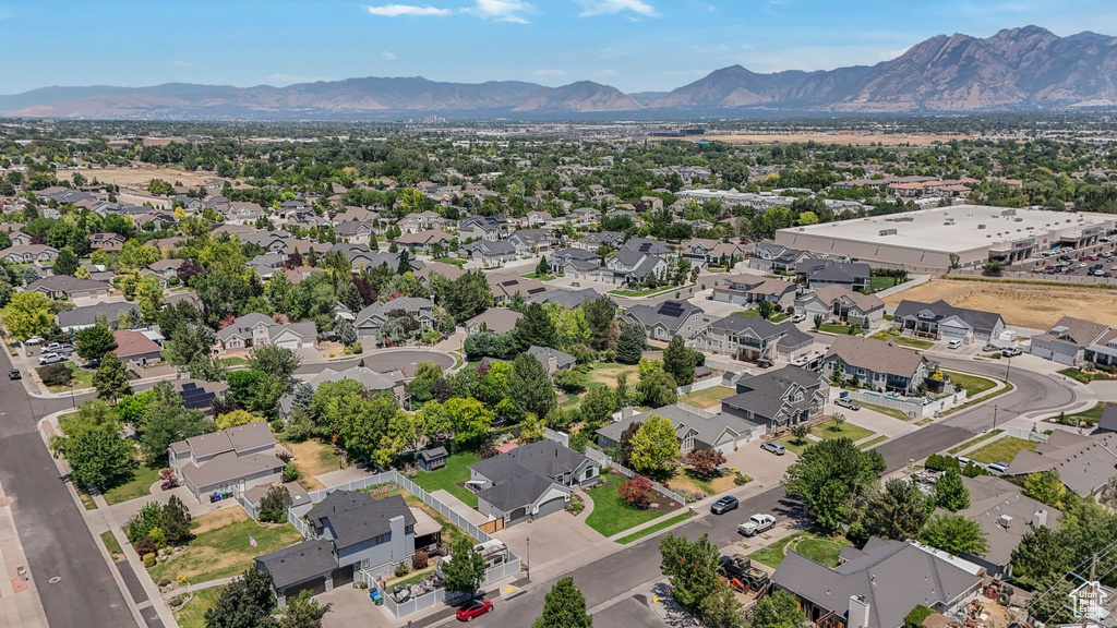 Aerial perspective of suburban area featuring a mountain backdrop