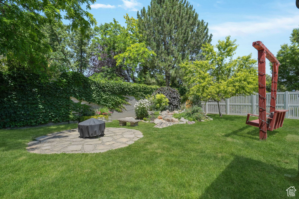 Fenced backyard with a patio area