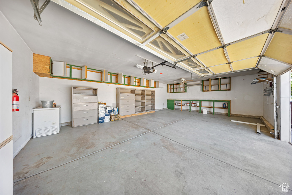 Garage featuring a garage door opener