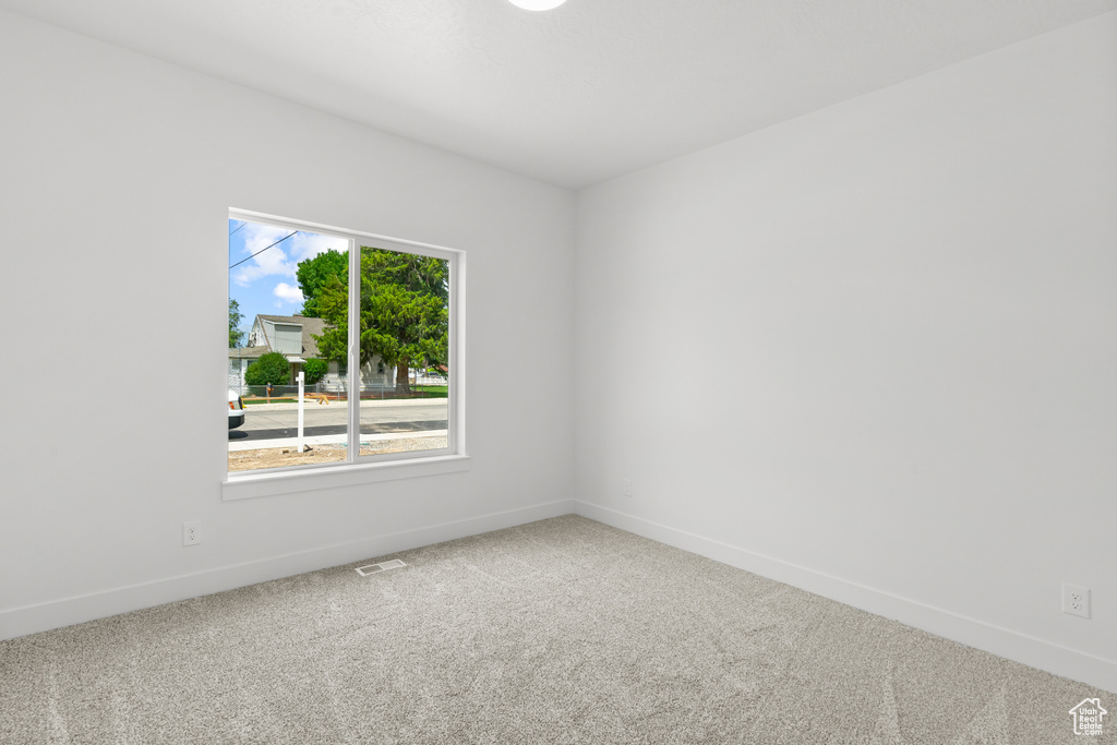 Empty room featuring carpet flooring