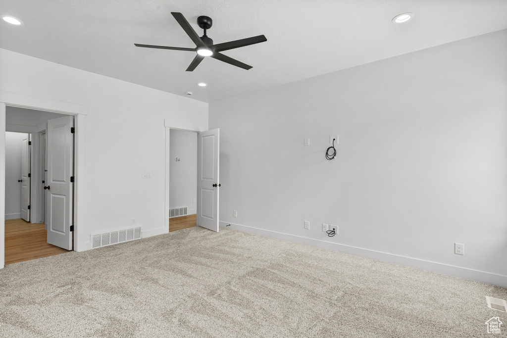 Unfurnished bedroom featuring carpet flooring, recessed lighting, and ceiling fan