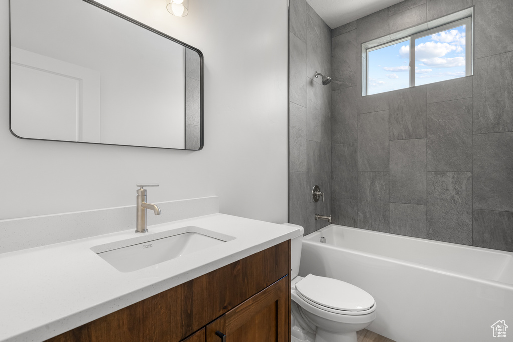 Bathroom featuring vanity and tub / shower combination