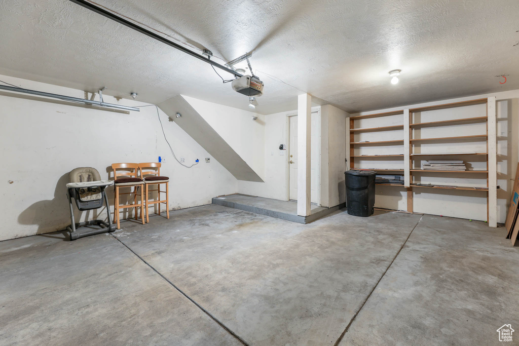 Garage featuring a garage door opener
