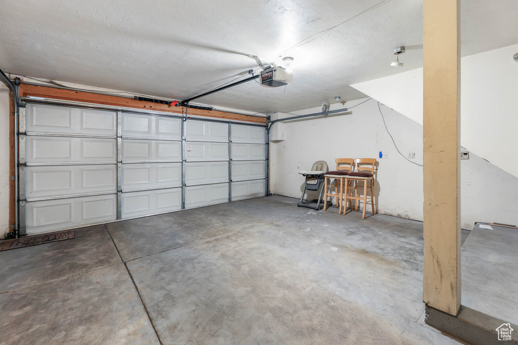 Garage featuring a garage door opener